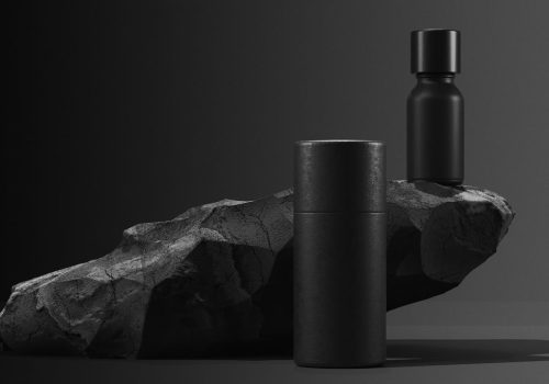 Bottle Of Essential Massage Oil On Stone Beauty Treatment Minimal Black Design Packaging Mock Up.jpg